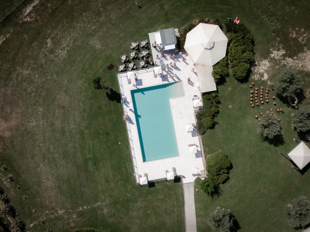 Aerial view of the poolside celebration at Tony and Patryk’s wedding in Tuscany.