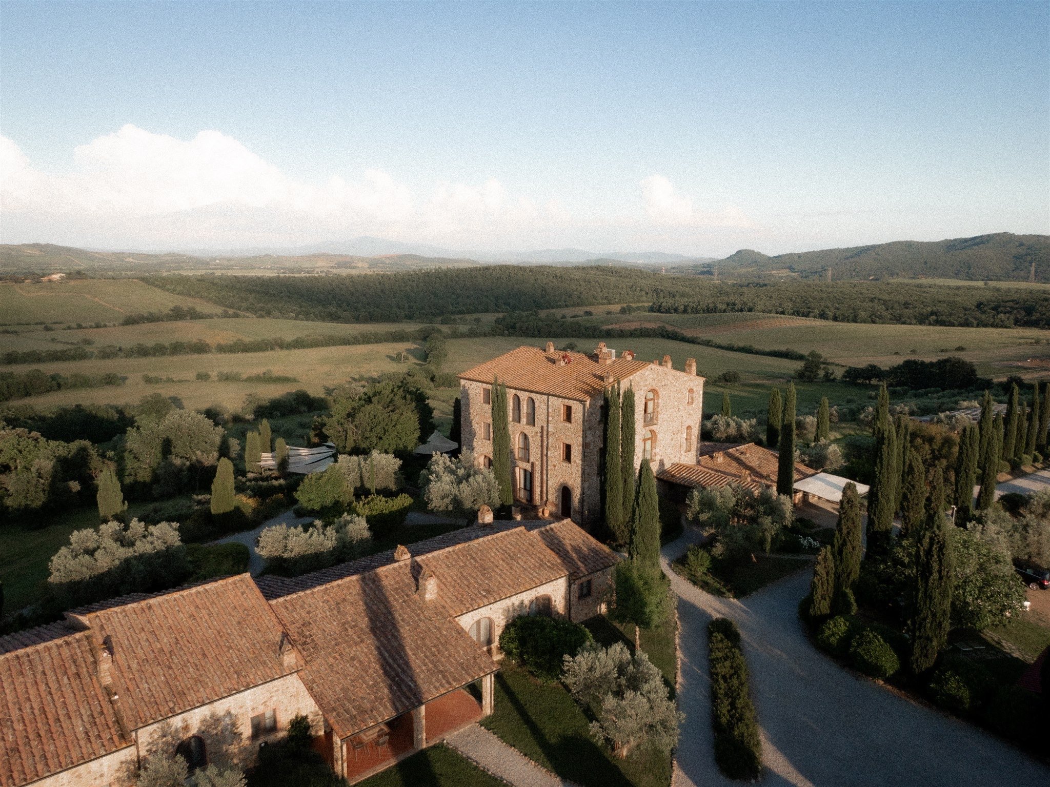 Aerial view of the Tuscan wedding estate, pool and surrounding grounds.