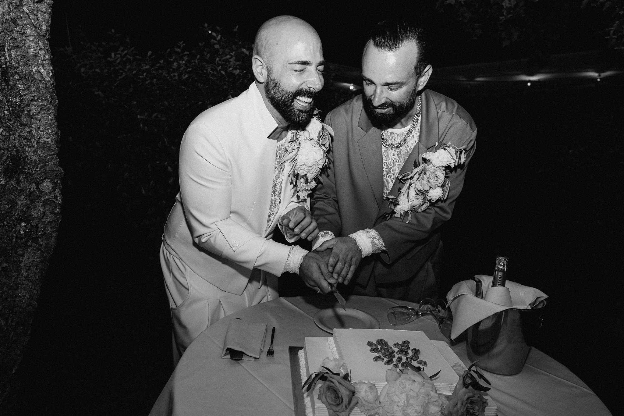 Tony and Patryk cut their wedding cake at the reception.