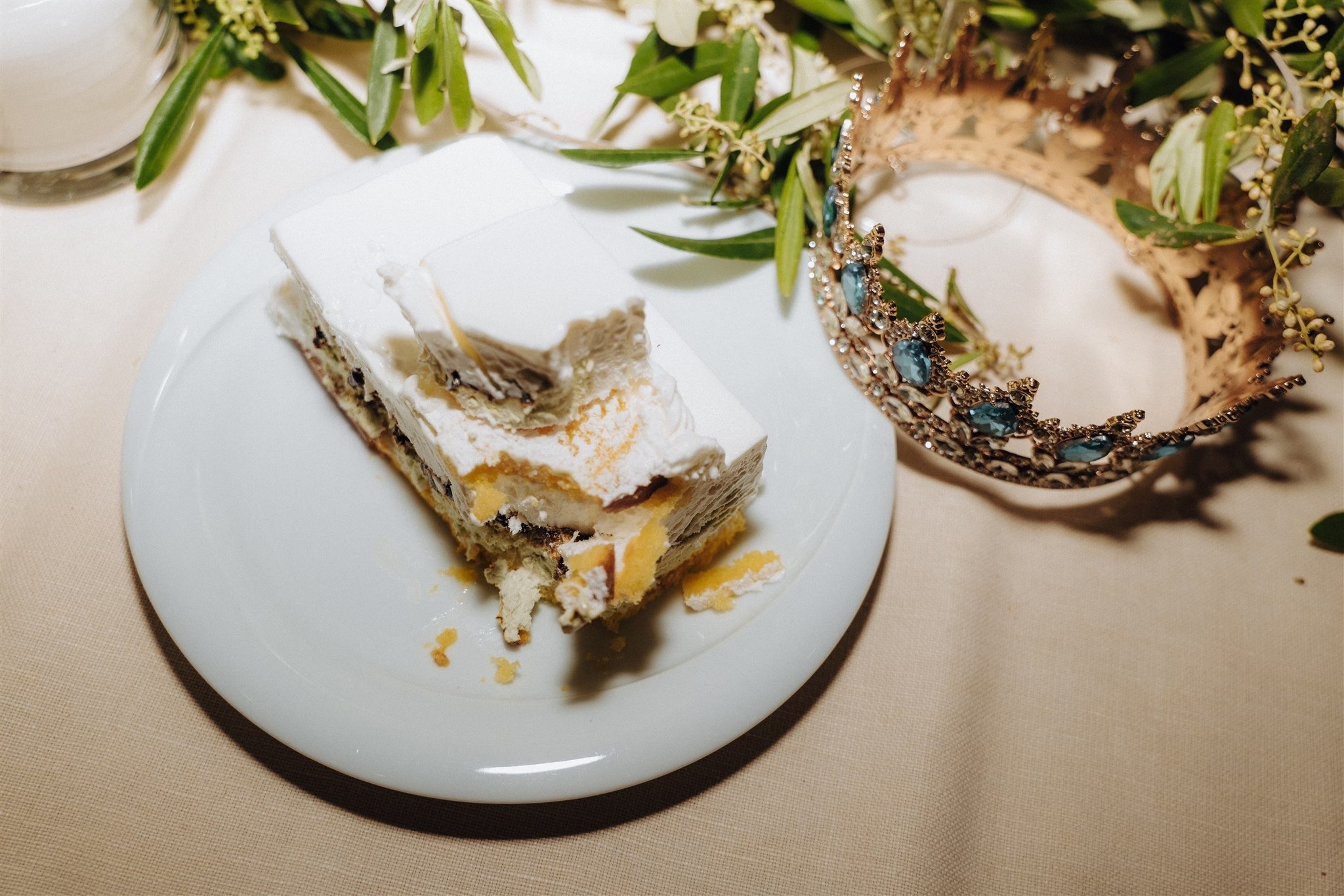 Close-up of wedding cake, flowers and personal details.