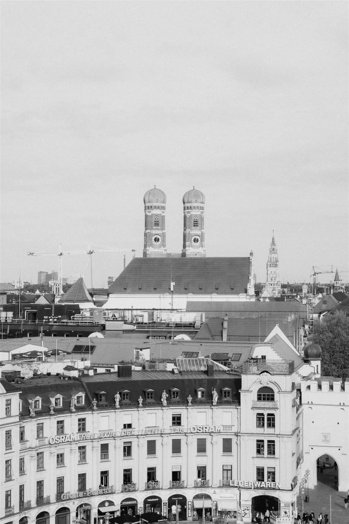 Black and white view over the old town of Munich with the towers of the Frauenkirche.