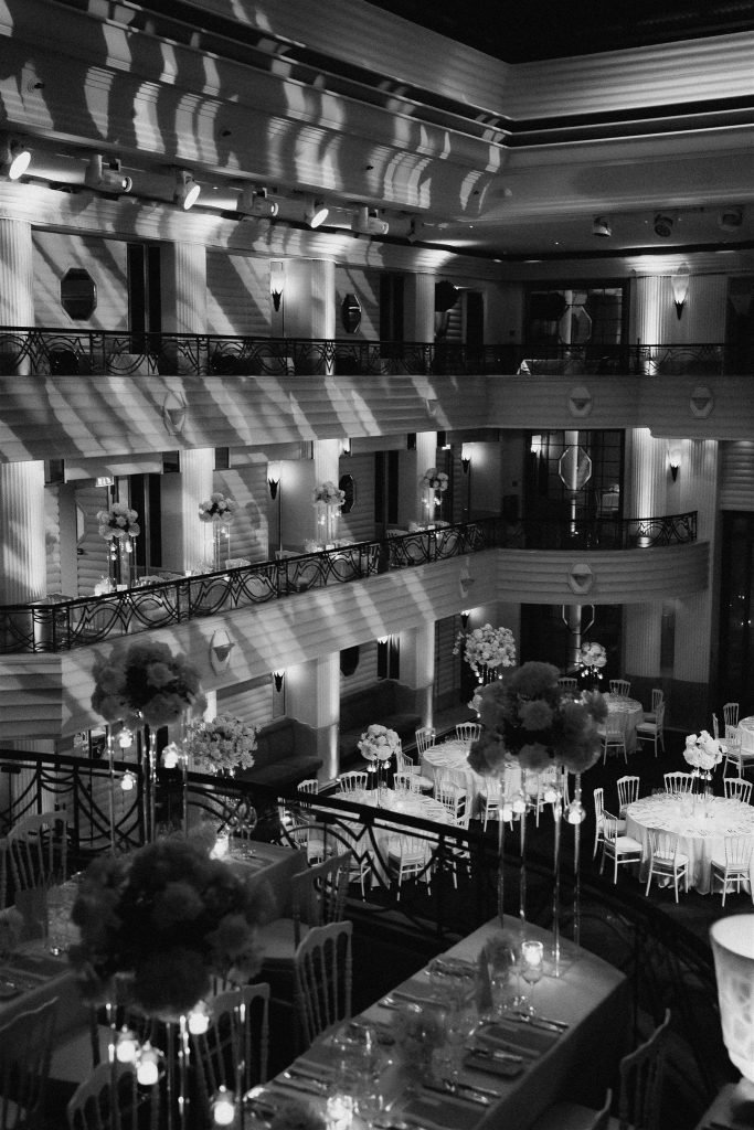 Ballroom at the Bayerischer Hof arranged with tables and floral decor for the wedding reception.