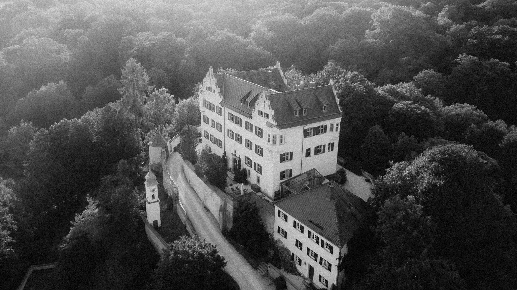 Black and white aerial of Schloss Duttenstein rising from the moat