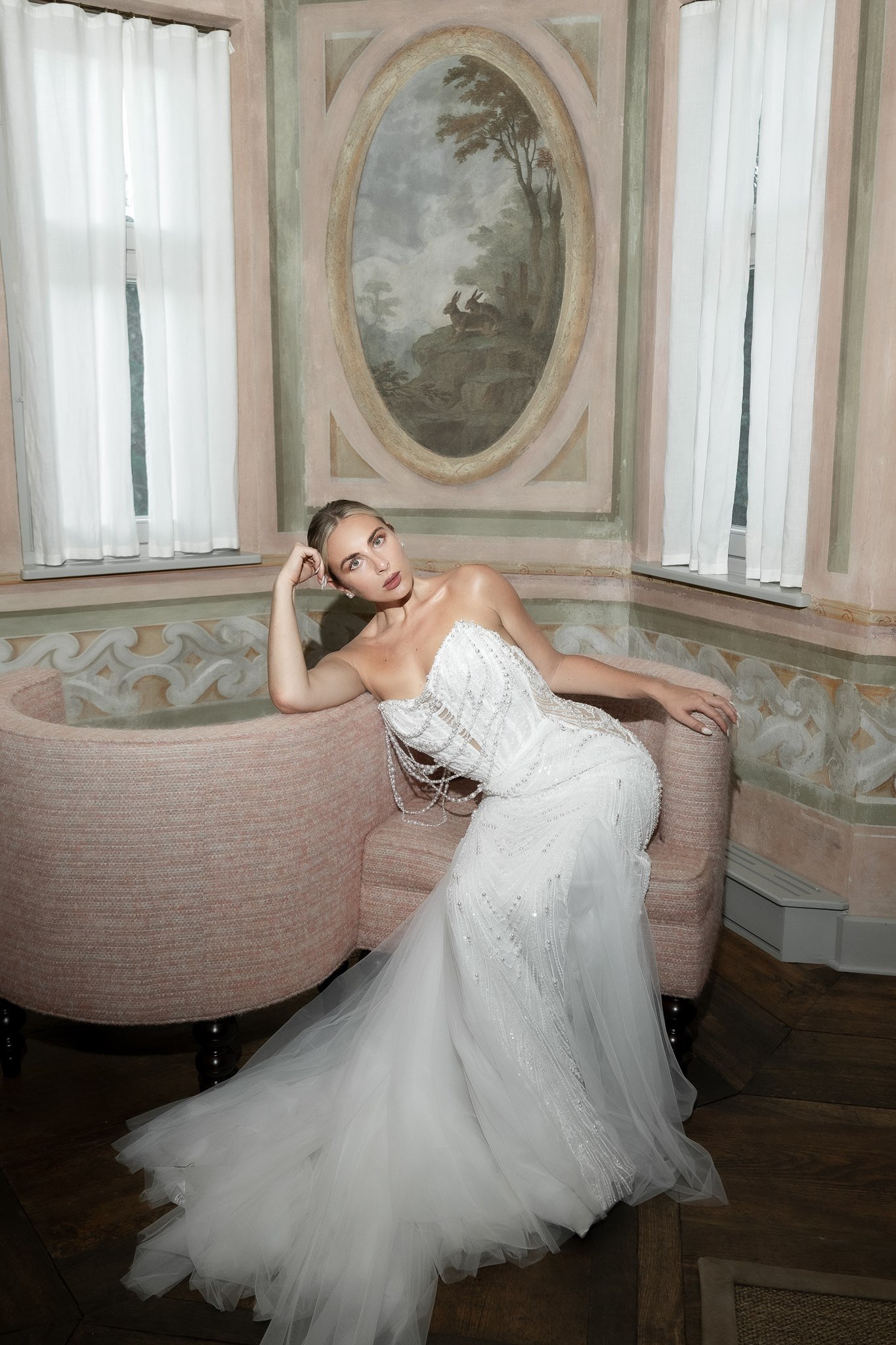 Bride resting on a chaise longue in the frescoed salon, Schloss Duttenstein