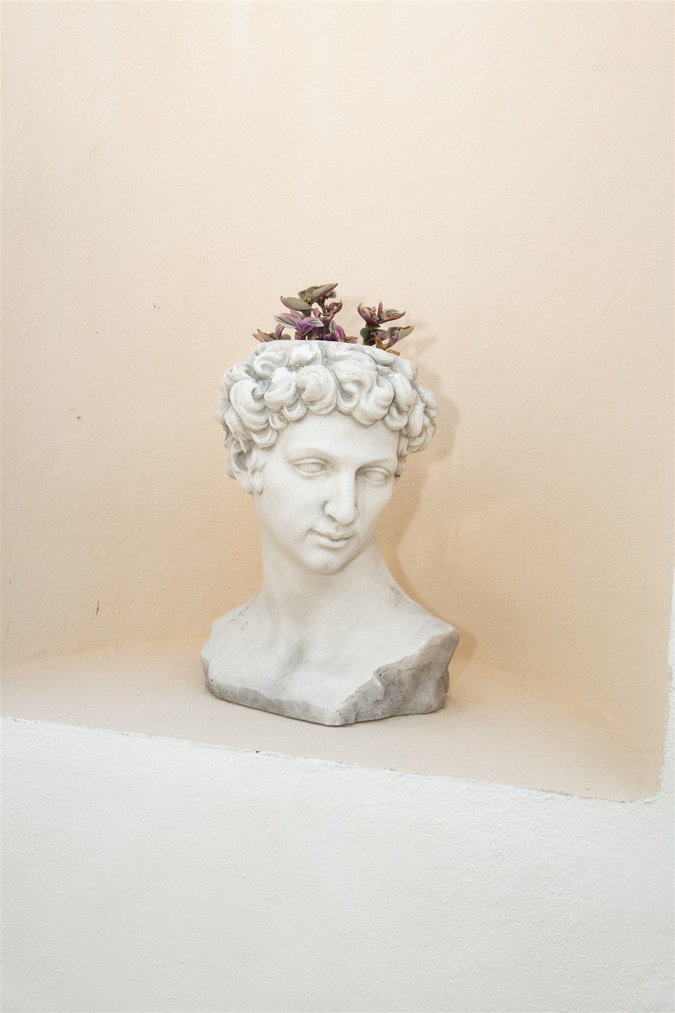 Classical bust planter on the villa terrace
