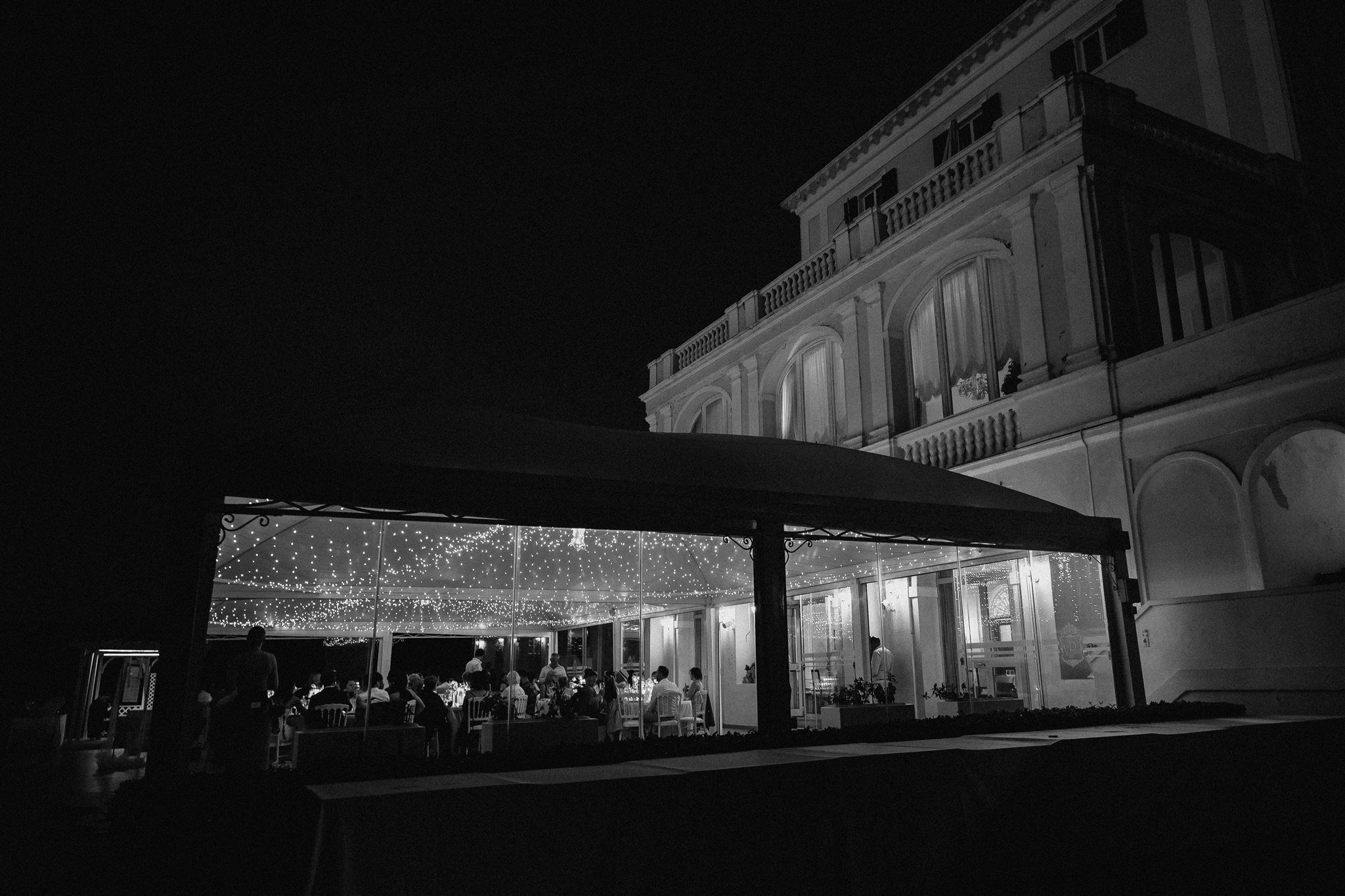 Terrace dinner under fairy lights at night